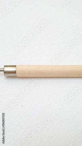 Stainless Steel Palette Knife with Wooden Handle moving on White Background, Artist Painting Tool for Acrylic and Oil Painting, vertical clip