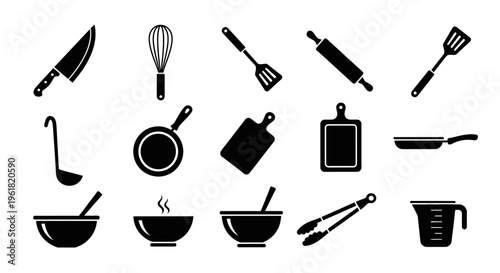 A collection of kitchen utensils and cookware on a table indoors.
