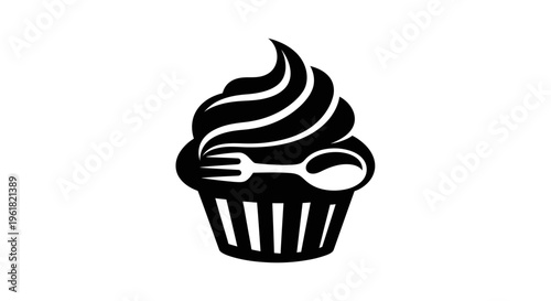 A cupcake with a fork and spoon is served on a plate indoors.