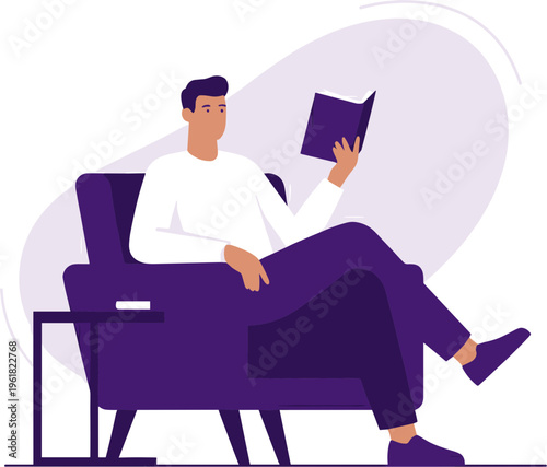 Man sitting on a chair reading a book in a relaxed indoor setting