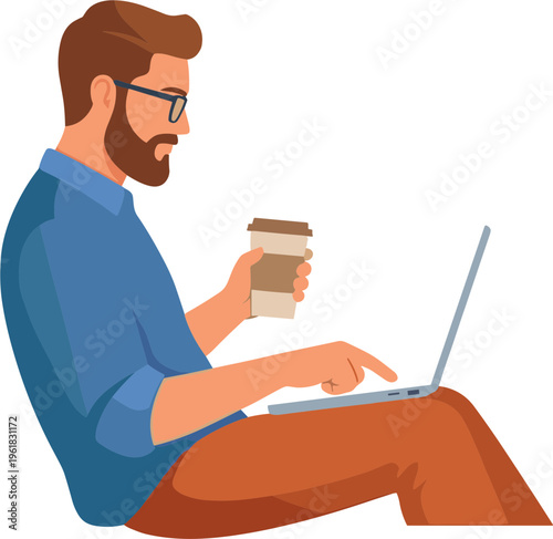 A man sits on the floor working on laptop while holding coffee