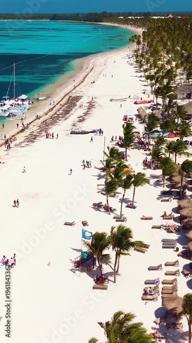 Aerial view of tropical beach, luxury resort with white sand on bright sunny day