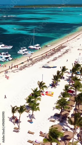 Aerial view of tropical beach, luxury resort with white sand on bright sunny day
