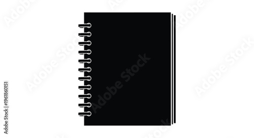 A black spiral notebook viewed from the side in silhouette