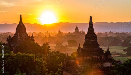 Ancient temple complex at sunrise with golden sky