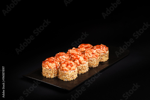 Delicious Fresh Salmon Sushi Rolls Presenting Exquisitely on a Black Background
