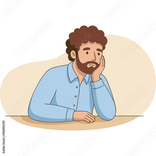 A man with brown hair and beard sits at a table looking sad