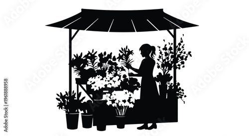 Silhouetted woman tending to flowers at a charming outdoor market stall