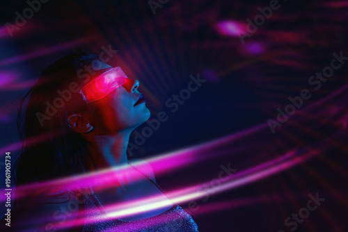 Woman using VR set with neon lights in futuristic cyberspace