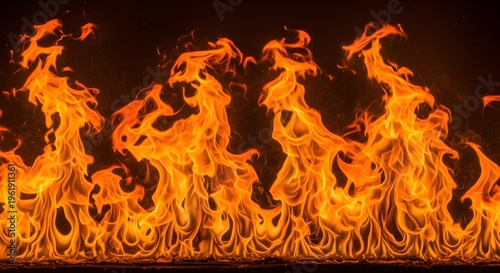 Dynamic and fiery orange flames dancing intensely against a dramatic dark backdrop, evoking raw power, warmth, and the mesmerizing beauty of a blazing inferno