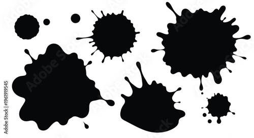 Abstract black ink splatters and blots on a white background