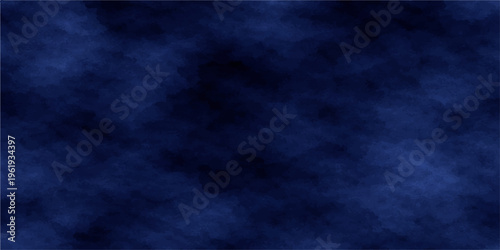 Abstract dark blue grunge background with a textured smoke design featuring soft light and stormy cloud patterns for a moody night sky wallpaper