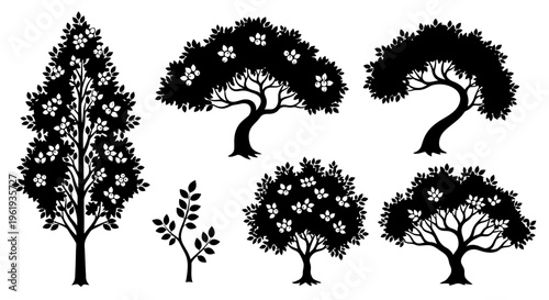 Set of diverse stylized trees and branches, black silhouettes on white background