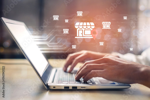 A professional typist works on a laptop in a contemporary office, illustrating digital marketing, e-commerce, and global business connections with visual elements. Gantry