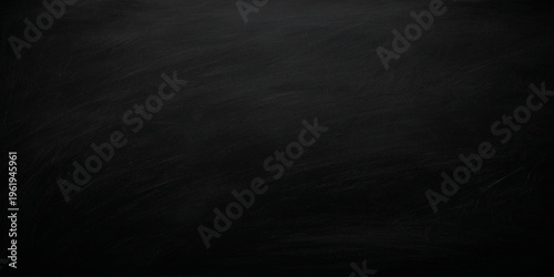 A dark and grunge blackboard background texture features a blank, rough surface with vintage black chalk marks on a dusty gray wall pattern