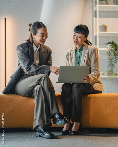 Business women discussing project ideas at informal meeting