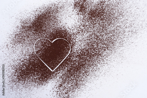 Cocoa powder on a white background, cocoa powder heart, copy space for text