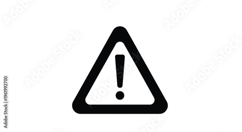 Black triangular warning sign with exclamation point a stark silhouette