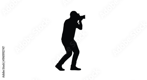 Photographer capturing a moment with a camera stark black silhouette