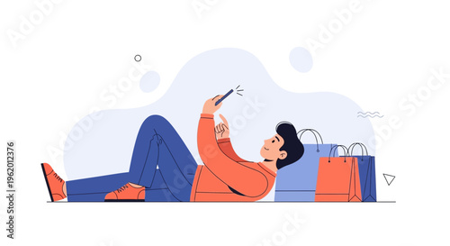 Man lying down using smartphone with shopping bags nearby, online shopping concept