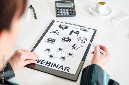 Webinar concept on a clipboard