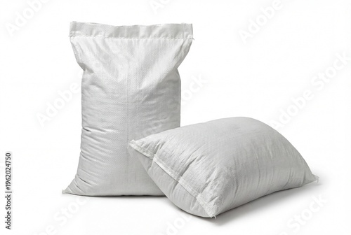 Two blank white woven polypropylene sacks isolated on white background one standing one lying down mockup for agriculture grain flour sugar rice fertilizer sand building materials packaging template