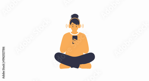 Woman in headphones listening to music on phone while sitting cross-legged