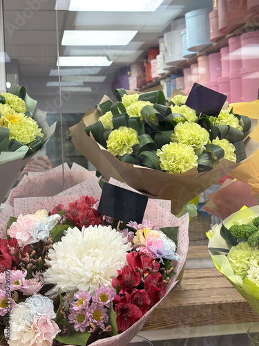 Bouquet of flowers in a shop window. Floral background