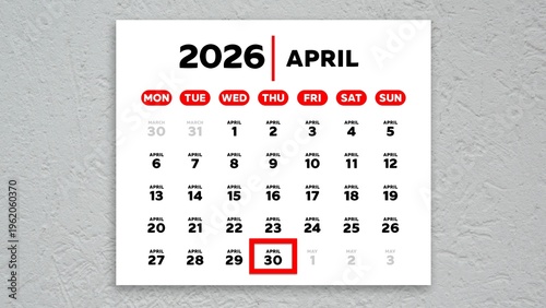 The date April 30th marked with a red cursor on the wall calendar 2026