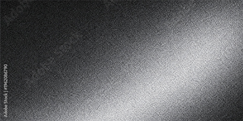 Textured metallic surface with a gradient, displaying an interplay of light and shadow, evoking a sense of industrial and modern aesthetic. 