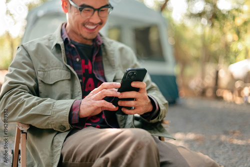 man using mobile phone holding cell phone texting message contact us.chatting,search internet shopping online.device communication connecting