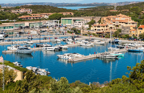 Porto Cervo Marina, one of the main tourist harbors in Sardinia and the Mediterranean, located in the heart of Costa Smeralda, Italy. Luxury marina with yachts and clear turquoise water.