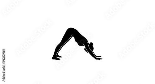 Silhouette of a woman performing downward-facing dog yoga pose