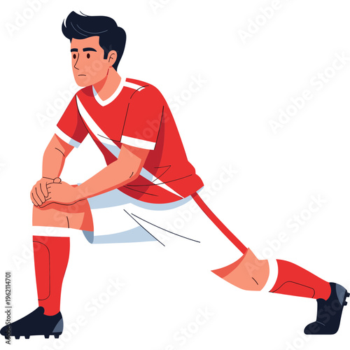 A soccer player wearing red stretches on the field outdoors.