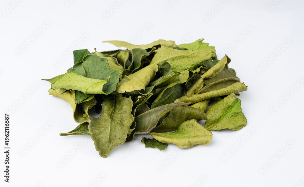 Fototapeta premium Thai lime dried leaves isolated, makrut lime or Citrus hystrix leaf pile, kaffir lime dry sprouts, Asia spices