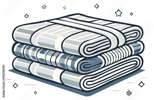 Stacked folded fabric linens with simple geometric patterns in monochrome colors and sparkling accents