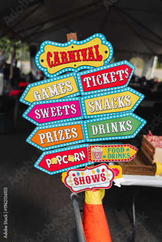 фотографія Colorful carnival direction signs at event