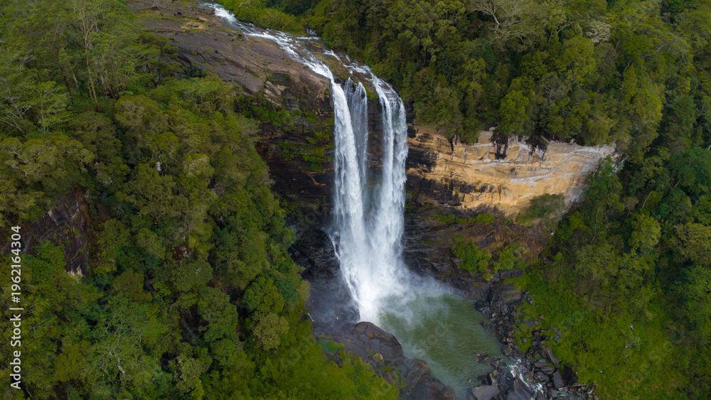 Obraz premium Waterfall in the mountains. Laxapana Falls. Areal view of Laxapana Falls.