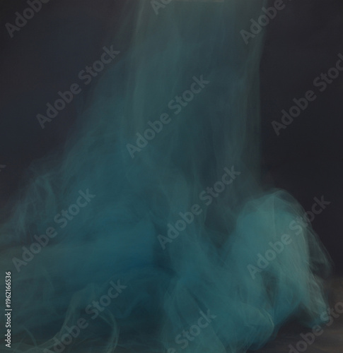 Soft blue tulle blur motion on dark background. Abstract airy cyan smoke mist fluidity overlay.