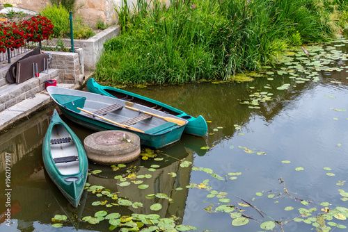 Bilde på lerret Canoes moored on the banks of a river