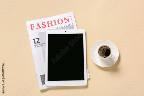 Tablet computer with cup of...