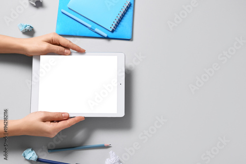 Female hands with tablet co...