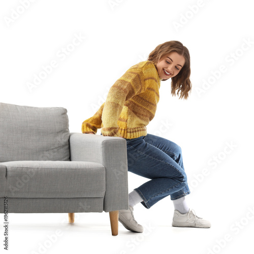 Young woman moving grey cou...