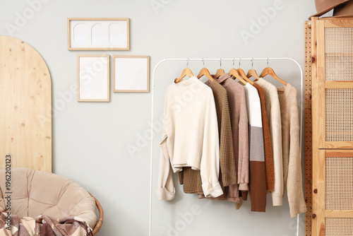 Rack with warm sweaters and...