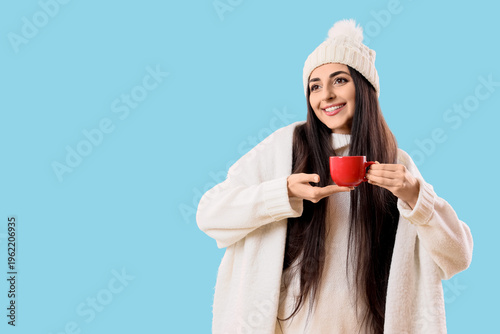 Happy young woman in winter...