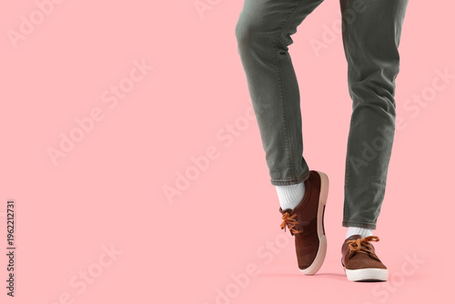 Legs of man in jeans with s...