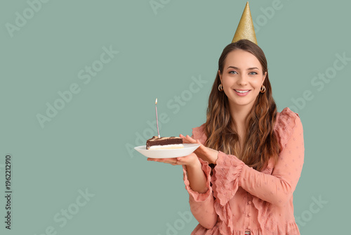 Young woman in party hat wi...