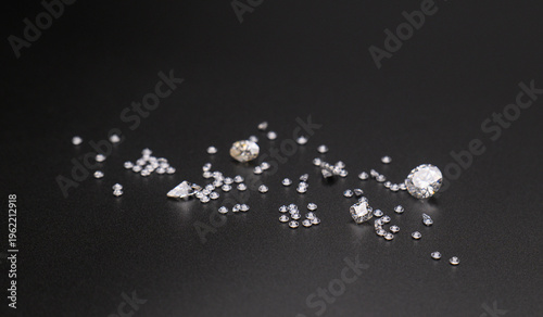 Dark background highlights sparkling gemstones of various sizes