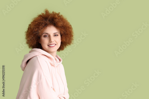 Redhead young woman with cu...