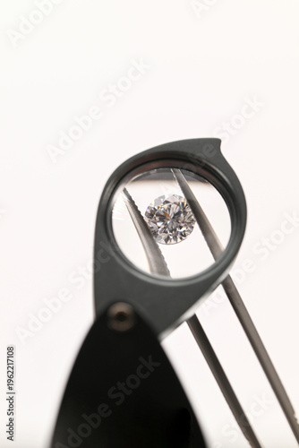 Close-up of diamond examined under magnifier